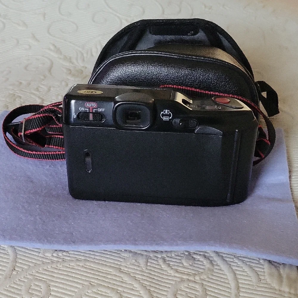 Canon Vintage Black Film Camera with Red Accents